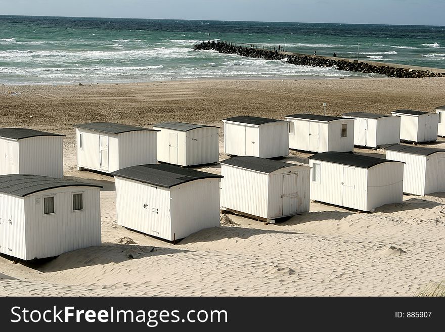 Summer in denmark:beach of loekken, beach houses in line