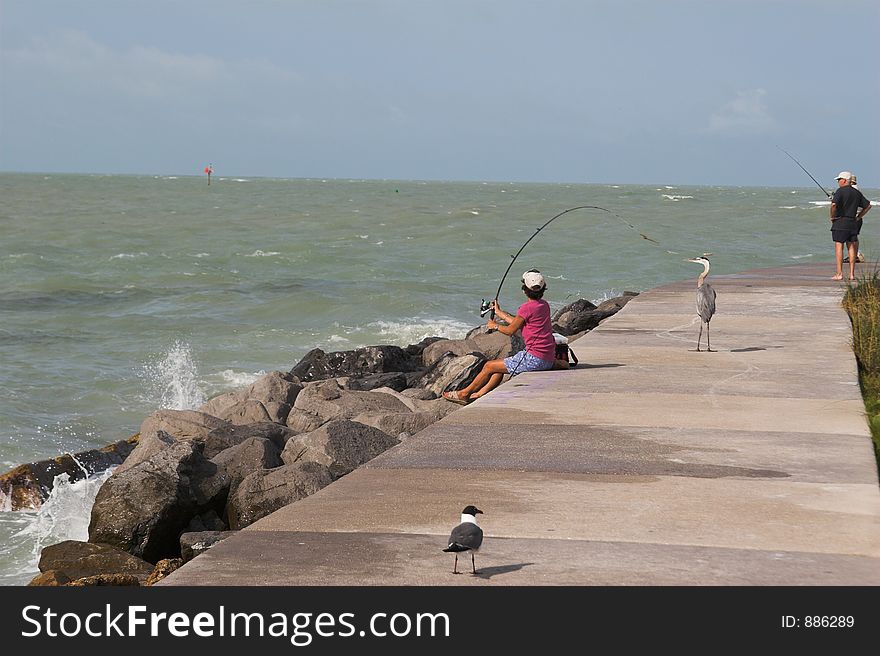 Woman fishing on local pier in florida