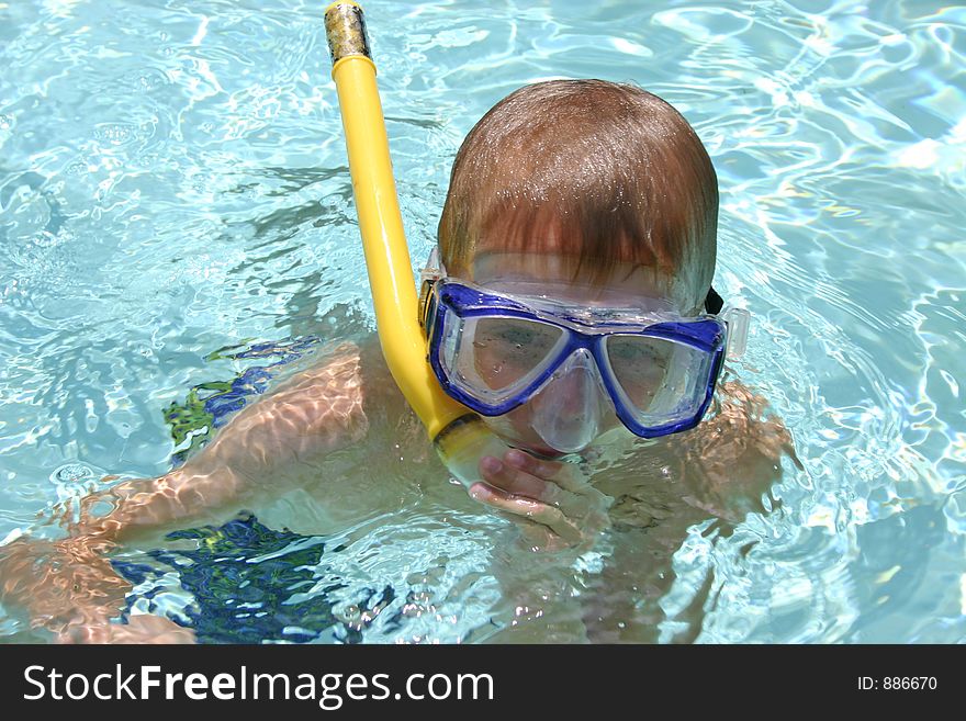 Boy snorkeling in pool. Boy snorkeling in pool