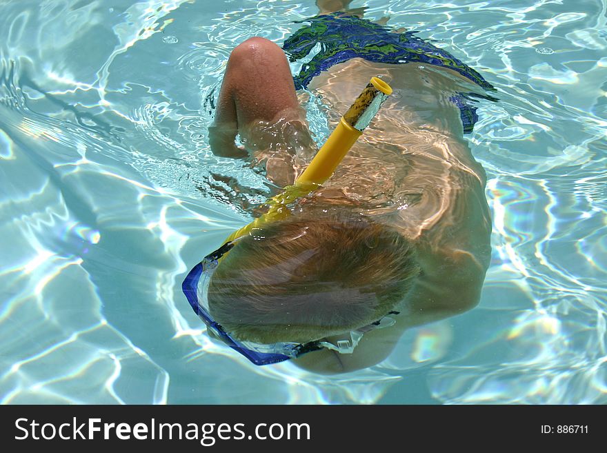 Boy snorkeling under water. Boy snorkeling under water