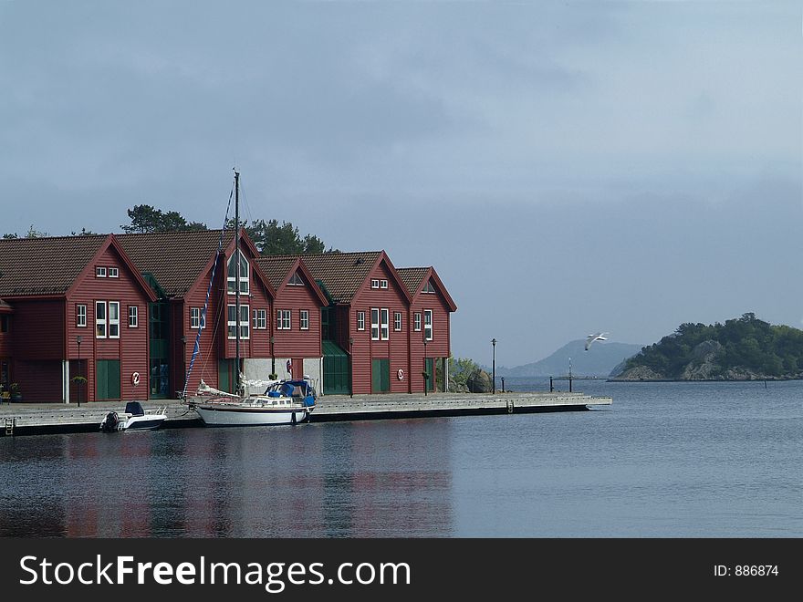 Sailboat at the quay in Farsund in Vest-Agder on the south coast of Norway. Sailboat at the quay in Farsund in Vest-Agder on the south coast of Norway