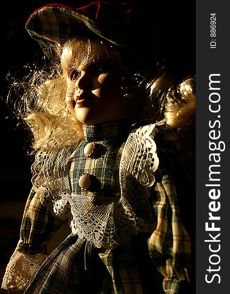 Still life, ceramic doll, back light