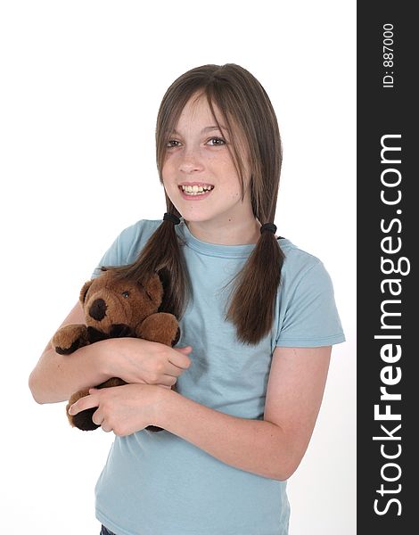 Little girl with big smile, holding a teddy bear. Shot on white. Little girl with big smile, holding a teddy bear. Shot on white.