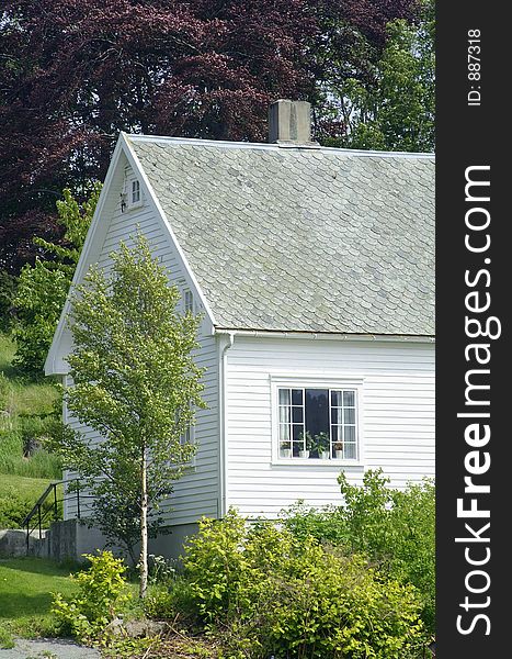 Traditional style white, wooden villa in Farsund of the south coast of Norway.