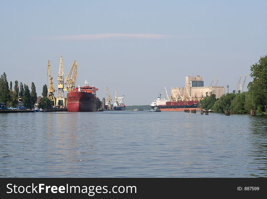 View at Odra river with ship, cranes and elevator. View at Odra river with ship, cranes and elevator