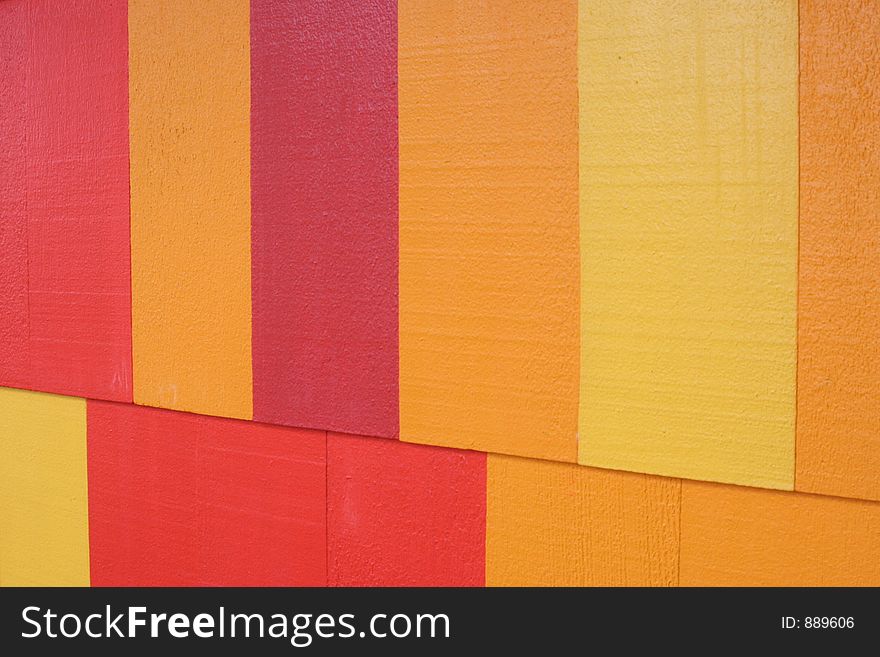Painted wood background in red, yellow and orange colors. Painted wood background in red, yellow and orange colors