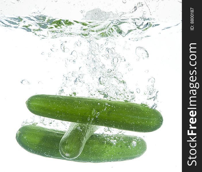 Vegetarian Food background.
Green cucumber