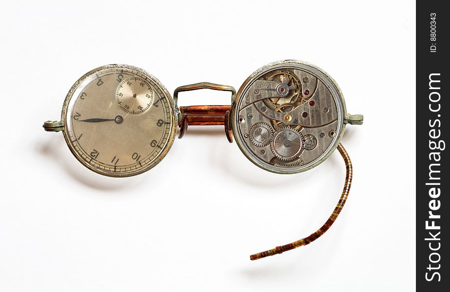 Photomontage with old spectacles and watch on white background. Photomontage with old spectacles and watch on white background