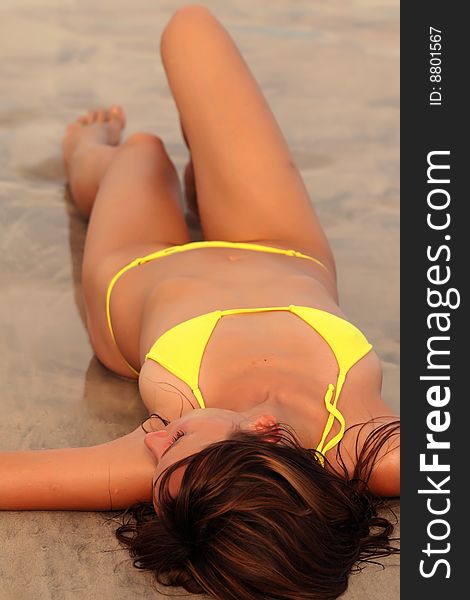 Bikini girl relaxing on the beach in caribbean. Bikini girl relaxing on the beach in caribbean