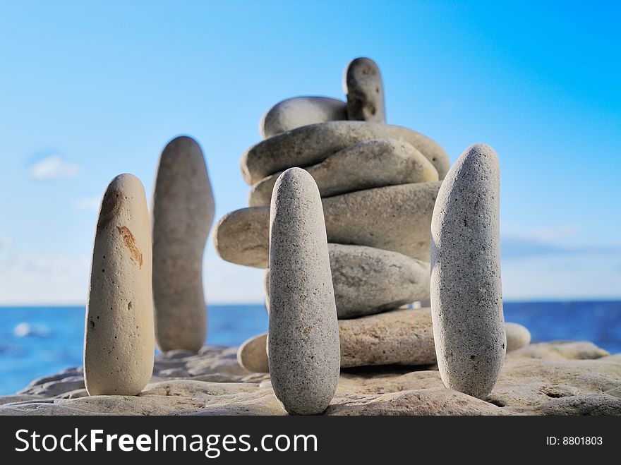 Group of cobble-stones on the shores of ocean as an ancient symbol. Group of cobble-stones on the shores of ocean as an ancient symbol