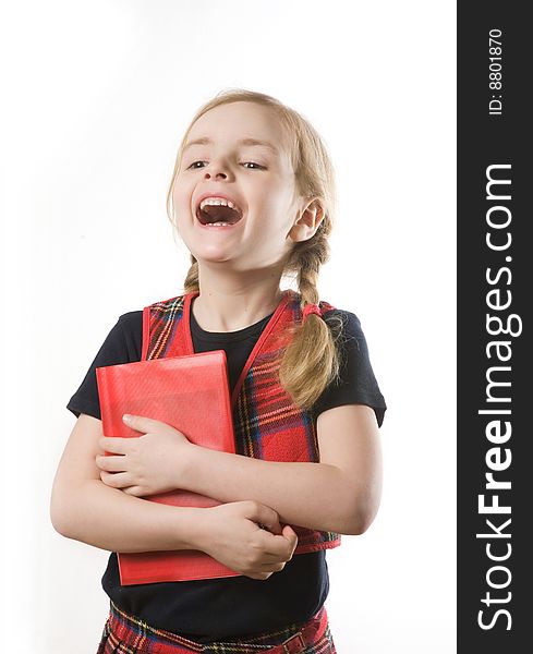 Happy schoolgirl with red book over white