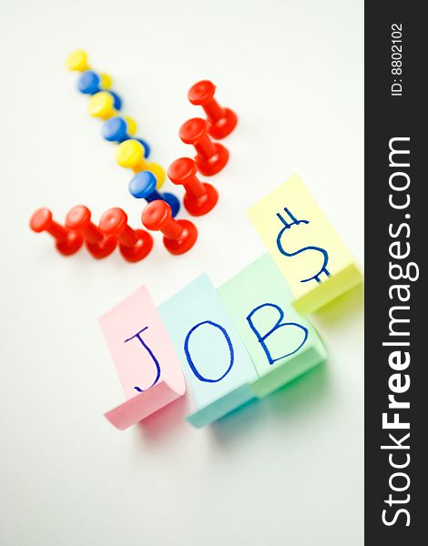Conceptual image of arrow sign pointing to a word JOBS. Conceptual image of arrow sign pointing to a word JOBS