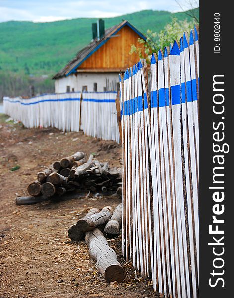 Fence and cottage of a village