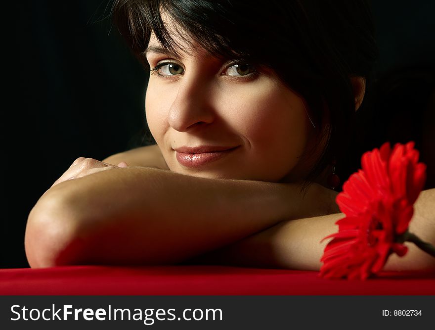 Young beautiful woman's  portrait on black background