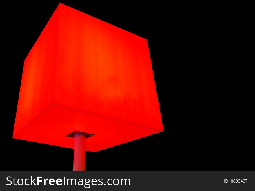 Illustration of red cube on leg at black background