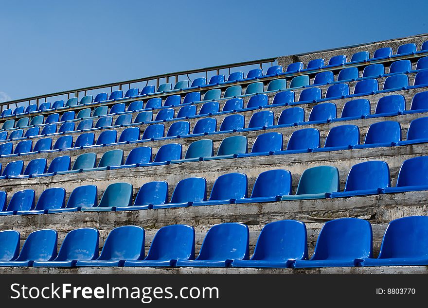 Empty tribune rows of blue. Empty tribune rows of blue