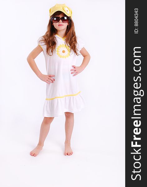 Acute young girl wearing a cover up and sunglasses. Acute young girl wearing a cover up and sunglasses