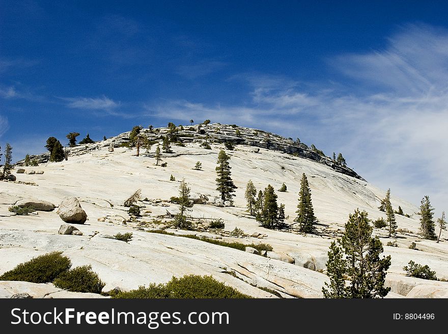 Glacial Dome against a dramatic sky in the High Sierras of Yosemite National Park in California. Glacial Dome against a dramatic sky in the High Sierras of Yosemite National Park in California