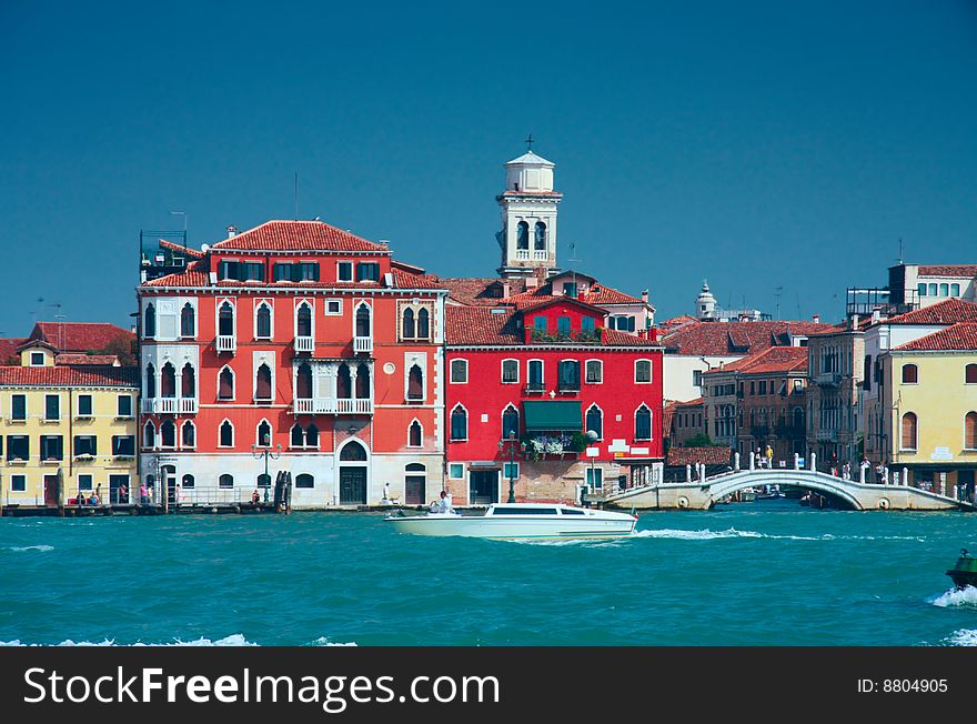 Colourful Venice embankment sea view with bridge and belfry