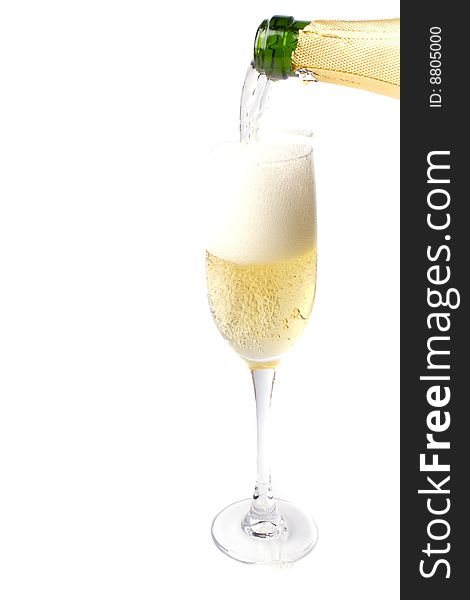 Champagne being poured into glass isolated on white background.
