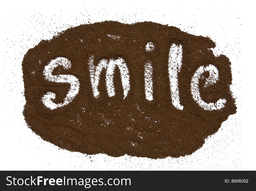 Word smile written in ground coffee