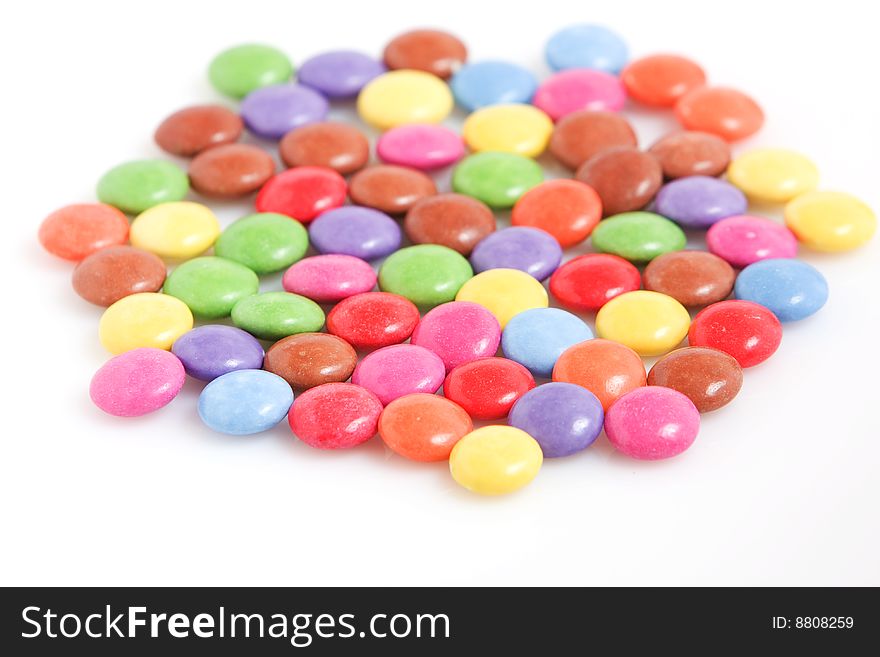Colorful chocolate candies isolated on white background