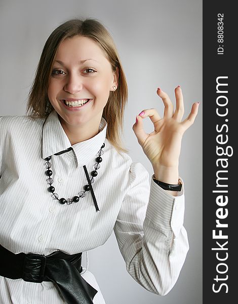 Young caucasian Businesswoman showing ok sign