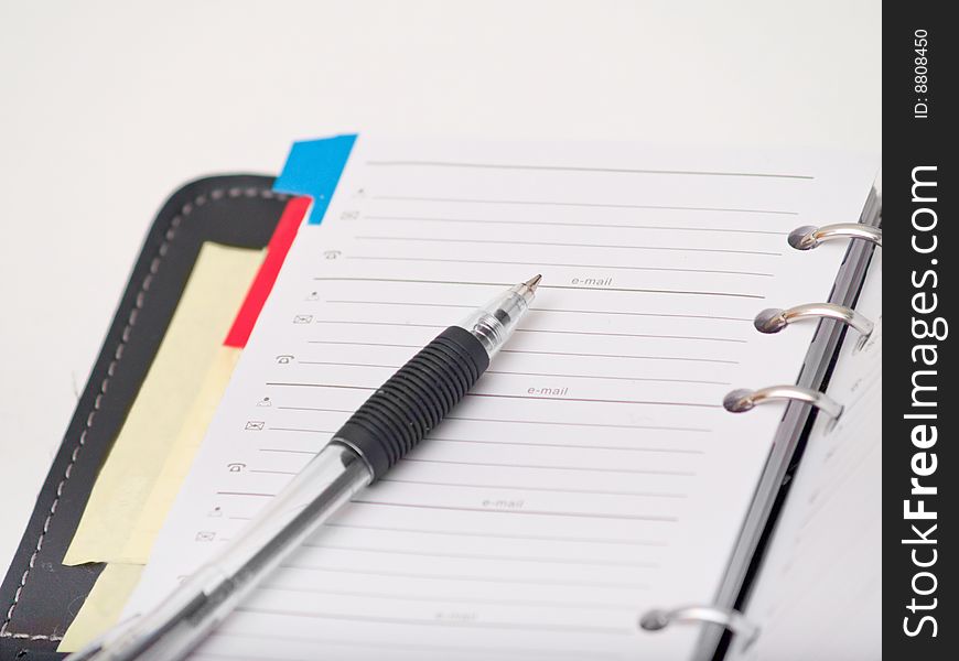 Office stationary - Pen and diary on white background