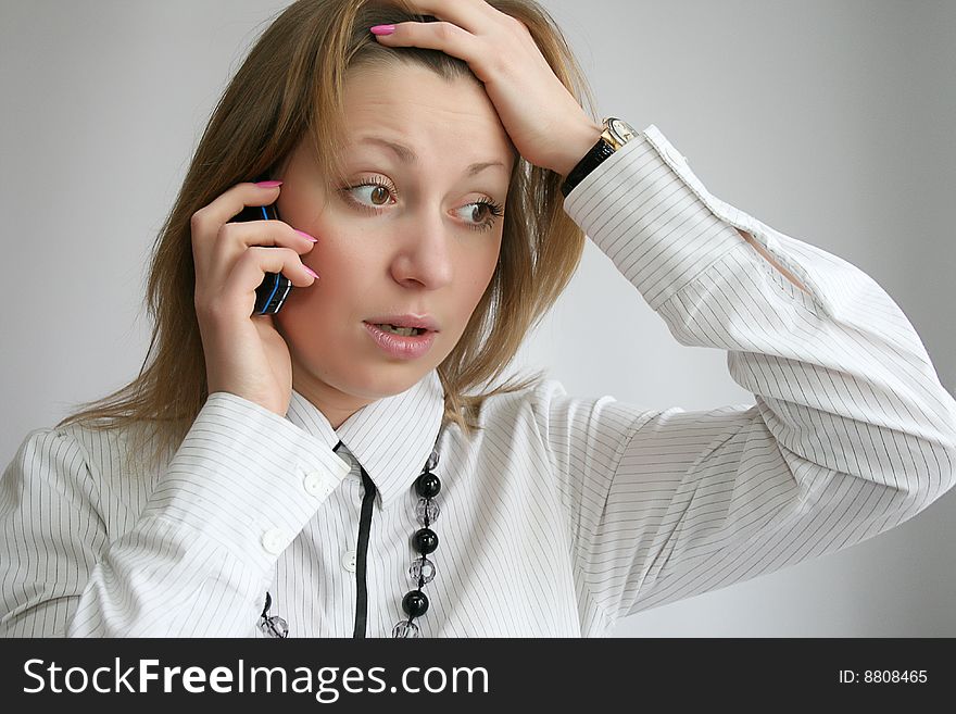 Attractive young woman calling by phone