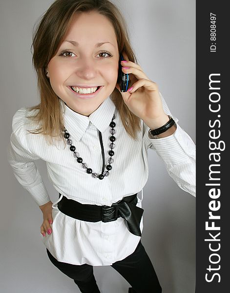 Attractive young woman calling by phone