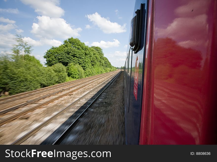 Railway tracks pictured from a speeding train. Railway tracks pictured from a speeding train