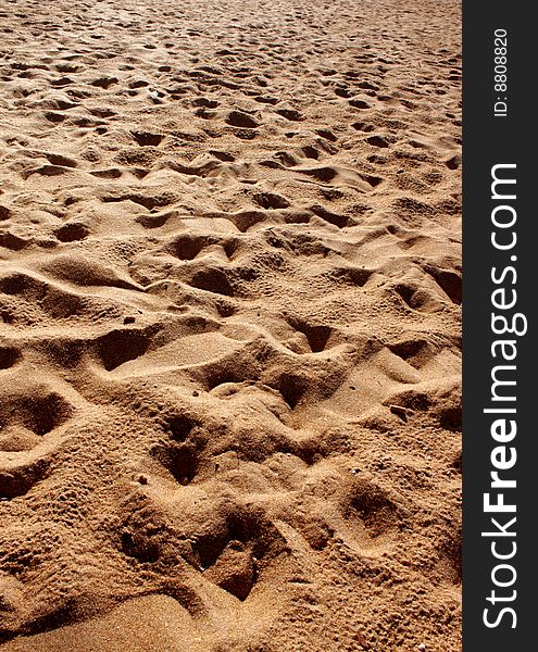 Trace of a foot of the person on sea sand. Trace of a foot of the person on sea sand