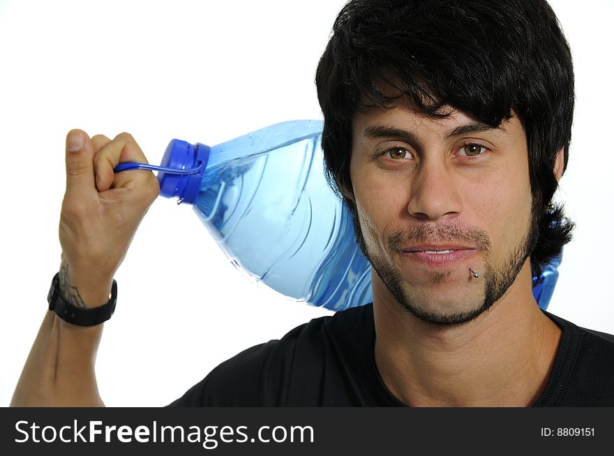 Portrait of young hispanic man carrying water bottle isolated