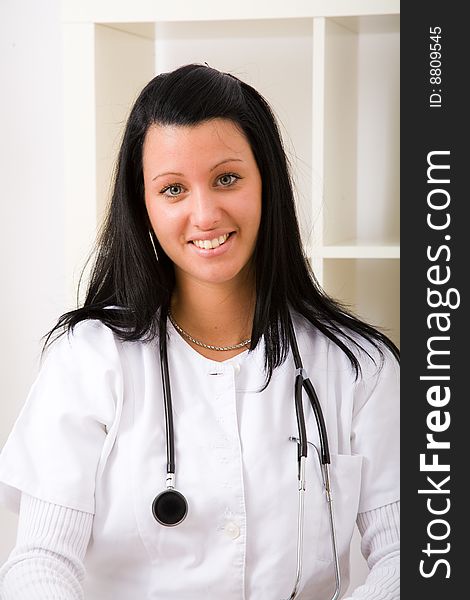 Beautiful young doctor in doctor's office