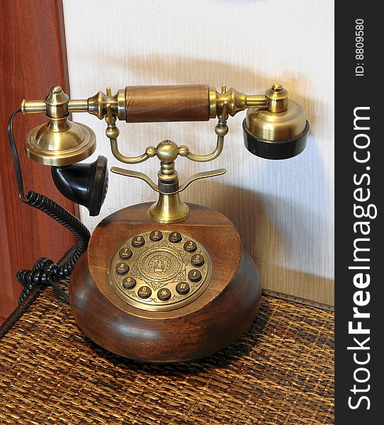 Analogue style telephone on wove wooden table