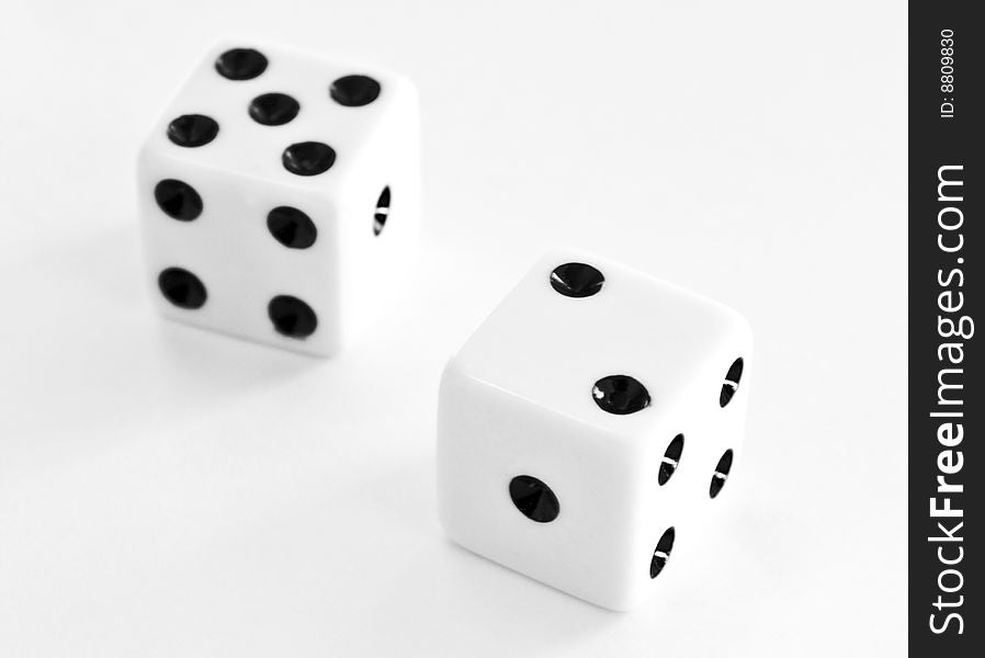 Close up of two dice on a white background. Close up of two dice on a white background
