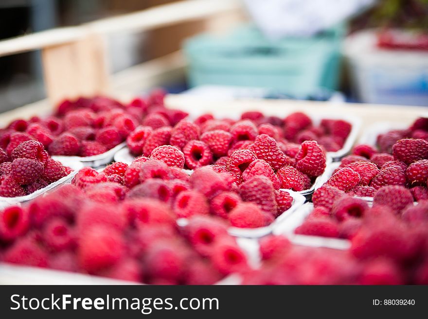 Red Raspberries On White Container