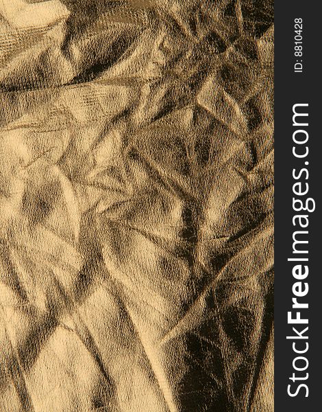 Texture of crumpled gold photo reflector. Texture of crumpled gold photo reflector