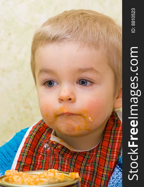 Cute little thoughtful boy during a meal. Cute little thoughtful boy during a meal