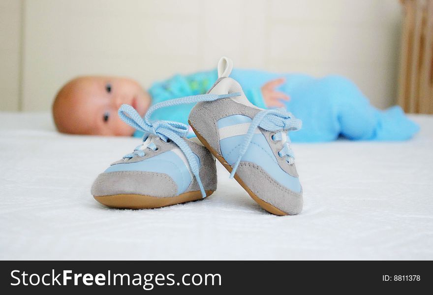 A child looking at the footwears