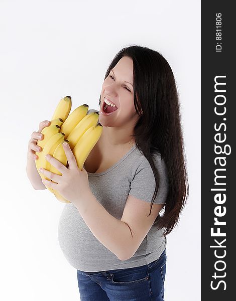 Pregnant woman with bananas isolated on white background