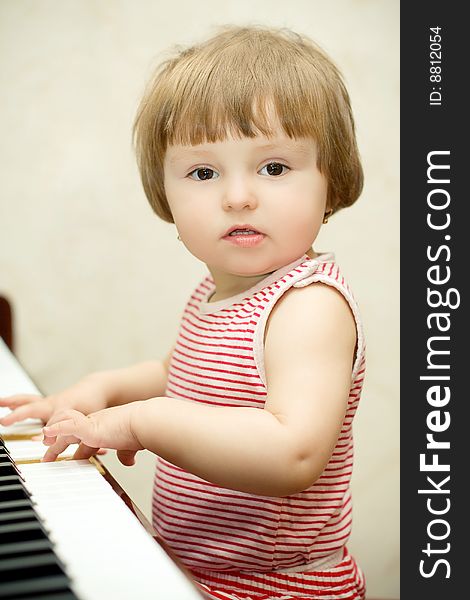 Little Girl Plays Piano