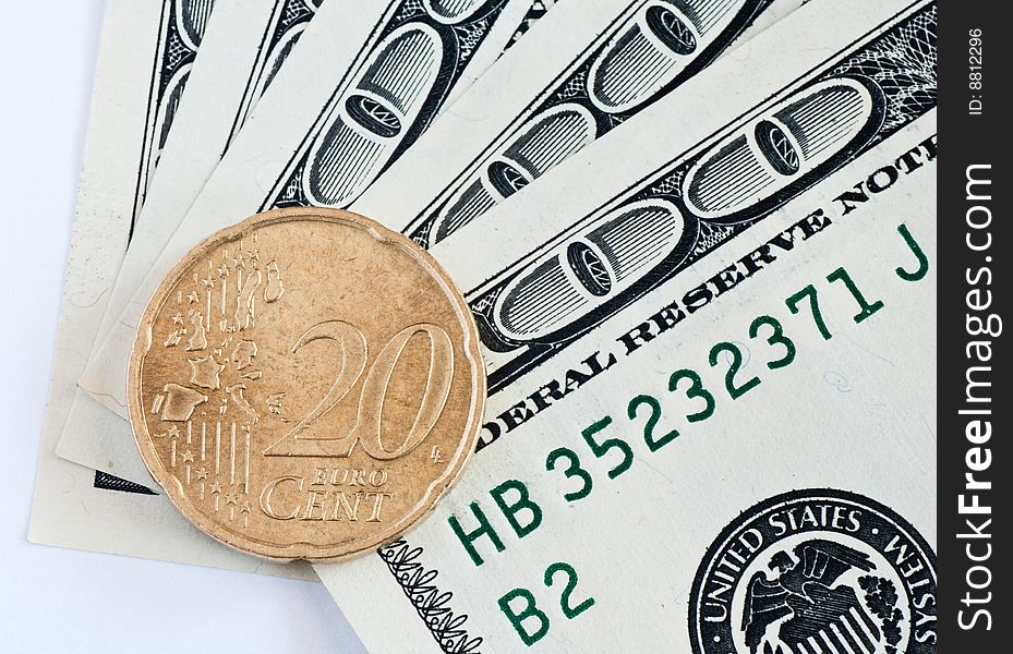 Close up macro shot of 100 dollar banknotes and euro coin. Close up macro shot of 100 dollar banknotes and euro coin