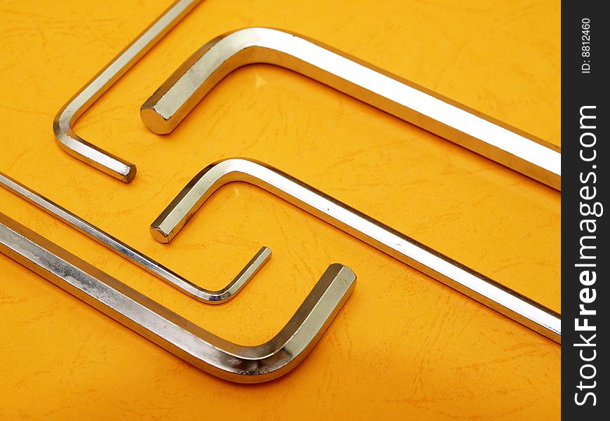 Five hex key set over contrasting orange background. Five hex key set over contrasting orange background