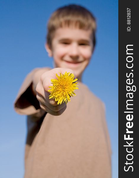 Boy Holding a Dandelion with Big Smile