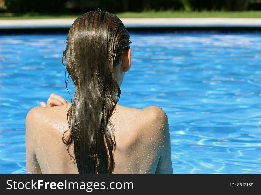 Girl bathing in the swimming pool. Girl bathing in the swimming pool