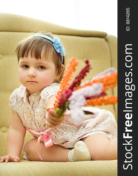 Little girl gives the flowers