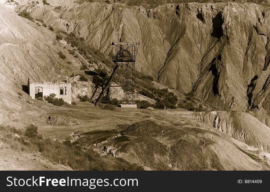 Abandoned old mining machinery in desert.