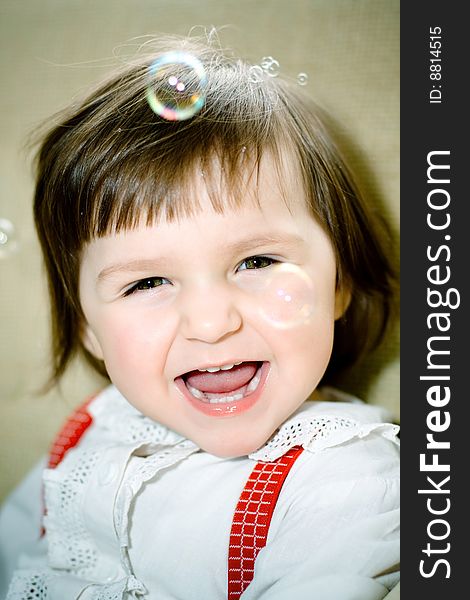 Funny girl in bubbles portrait