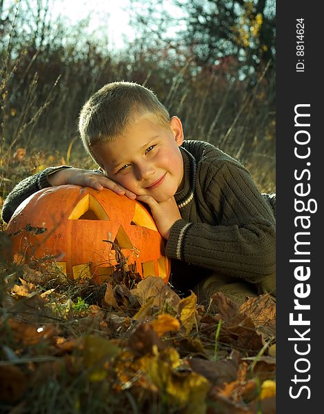 Little boy with halloween pumpkin. Little boy with halloween pumpkin
